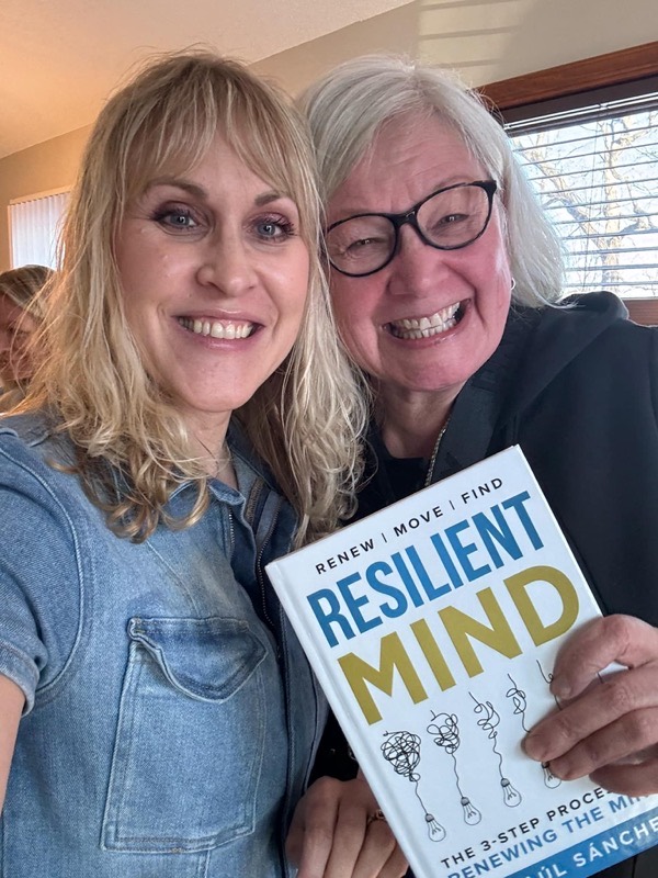Reader 4 with their copy of RESILIENT MIND